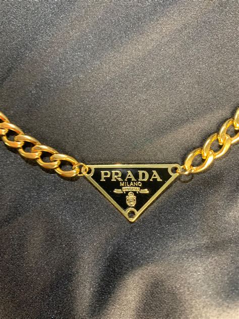 prada gold necklace.